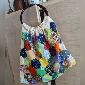 Vintage Handmade patchwork granny hobo style bag with plastic ring handles.